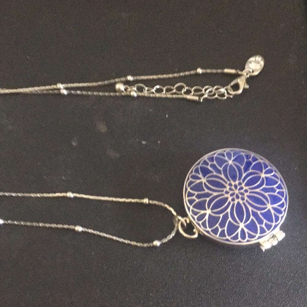 Necklace Pendant is Blue/Silver Locket. Long Chain has Silvertone Balls Spread